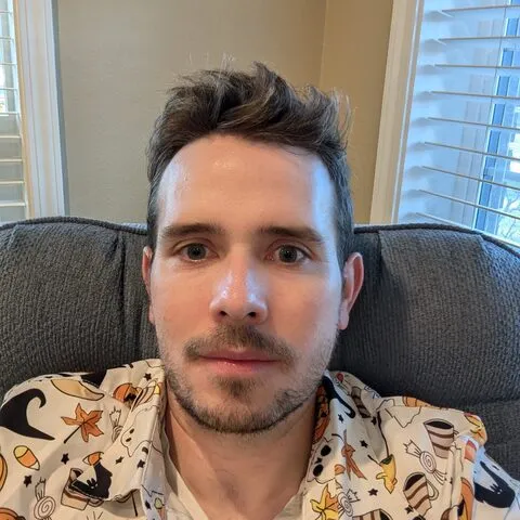 Doug in a Halloween-print shirt